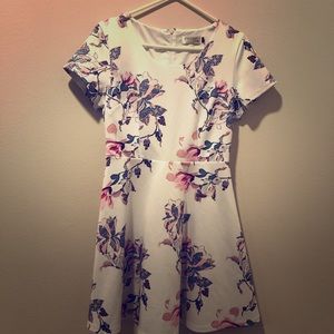 White dress with blue and pink floral pattern
